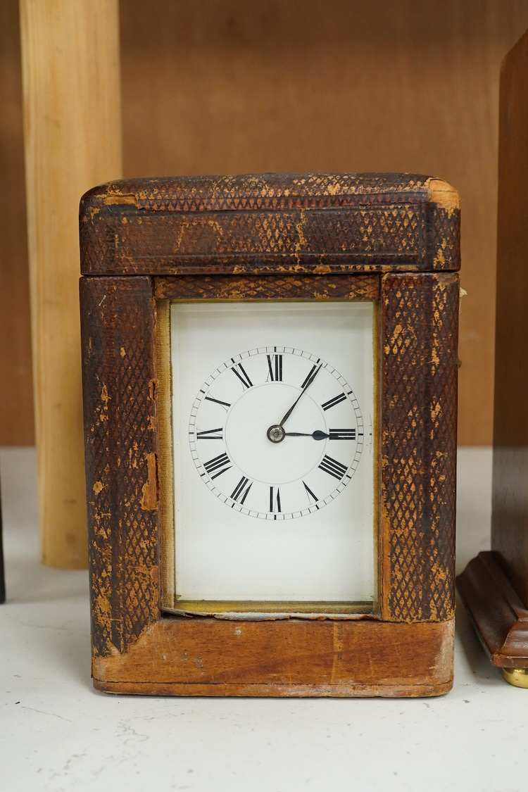 A late 19th century lacquered brass repeating carriage clock, by Henri Jacot and an Edwardian inlaid mantel timepiece with key, largest 23cm high